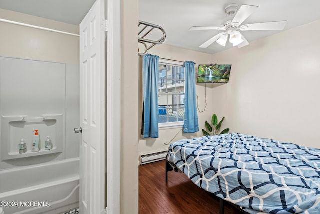 bedroom with a baseboard heating unit, ceiling fan, and dark hardwood / wood-style flooring