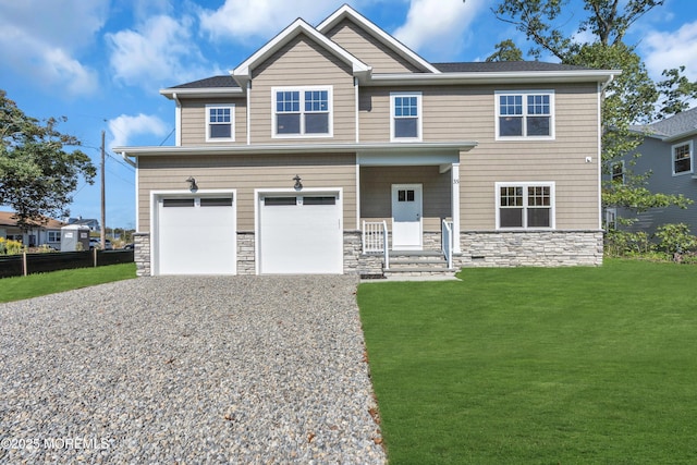 craftsman-style home featuring a garage and a front yard