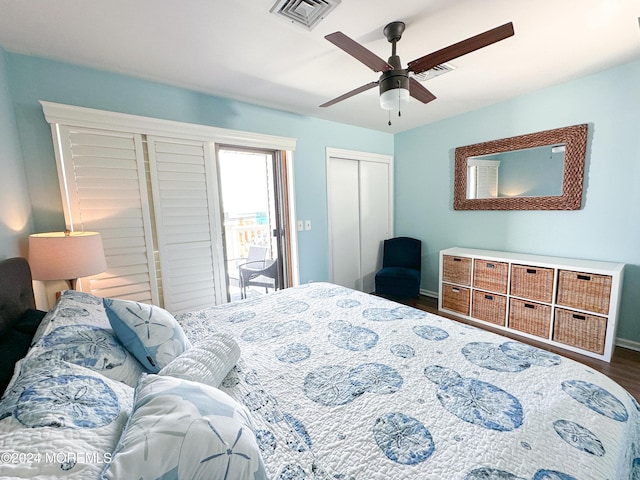 bedroom with dark hardwood / wood-style floors, ceiling fan, a closet, and access to exterior