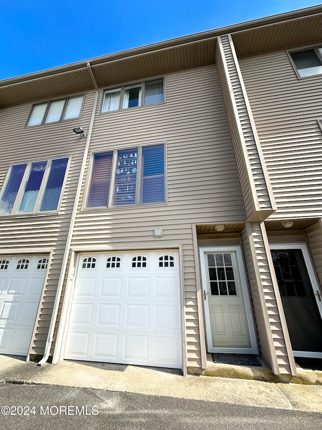 view of property exterior featuring a garage