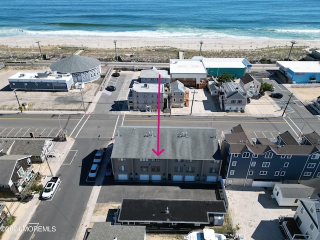 bird's eye view featuring a beach view and a water view