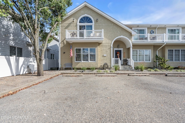 front of property featuring a balcony