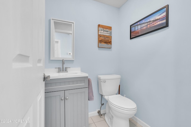 bathroom with vanity, tile patterned flooring, and toilet