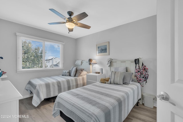 bedroom featuring ceiling fan and light hardwood / wood-style flooring