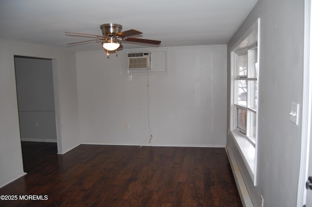 empty room with ceiling fan, dark hardwood / wood-style floors, and an AC wall unit