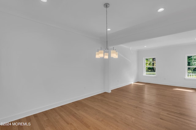 spare room with light wood-style flooring, baseboards, and recessed lighting