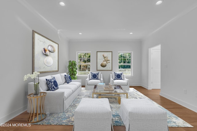 living area featuring recessed lighting, baseboards, and wood finished floors