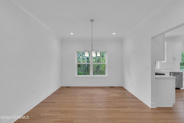 unfurnished dining area with baseboards, ornamental molding, recessed lighting, and light wood-style floors