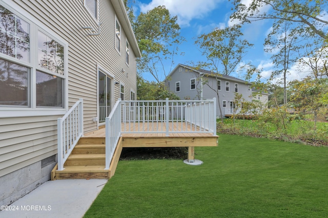 wooden deck with a yard