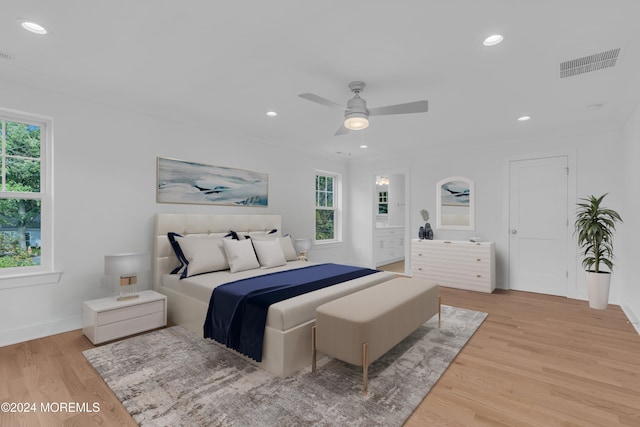 bedroom featuring light wood-type flooring, visible vents, and recessed lighting