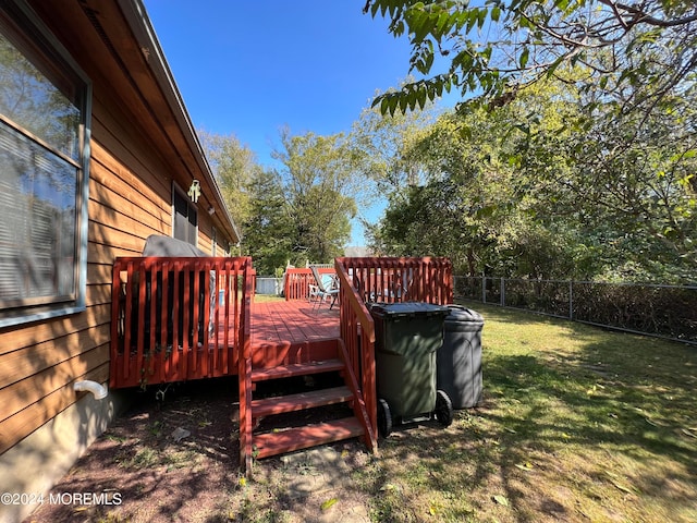 wooden deck with a yard