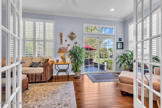 interior space featuring french doors, ornamental molding, and hardwood / wood-style floors