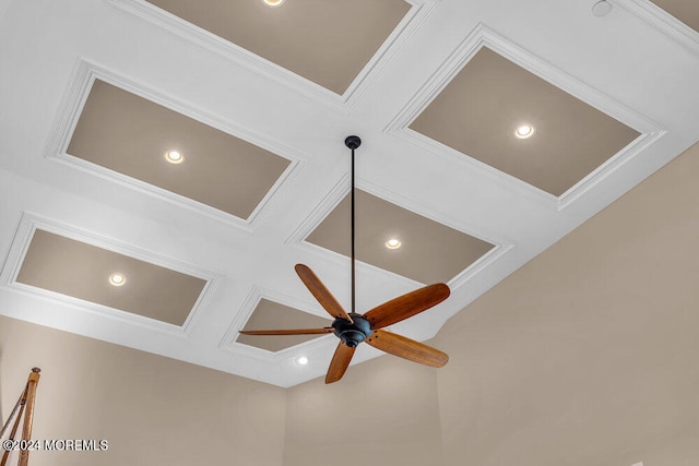 interior details with crown molding, coffered ceiling, and ceiling fan