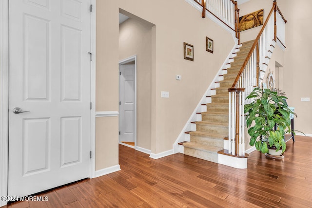 staircase featuring hardwood / wood-style flooring