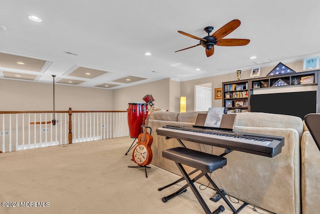 misc room featuring ceiling fan, beamed ceiling, crown molding, light colored carpet, and coffered ceiling