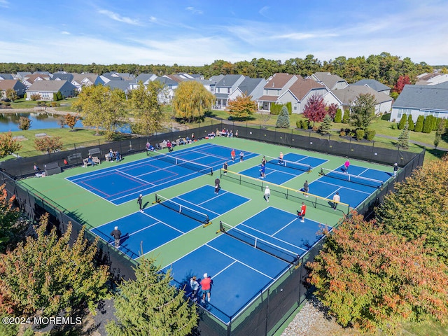 view of sport court featuring a water view