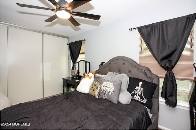 bedroom with a closet and ceiling fan