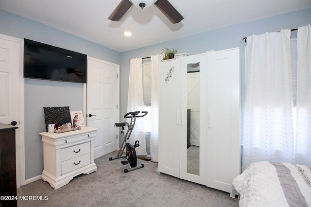 carpeted bedroom featuring ceiling fan