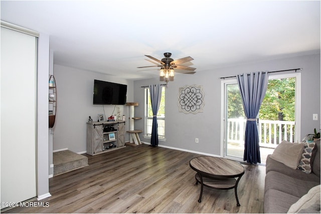 living room featuring hardwood / wood-style flooring and ceiling fan