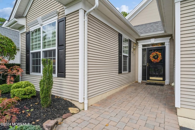 entrance to property featuring a patio