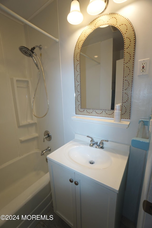 bathroom with vanity and washtub / shower combination