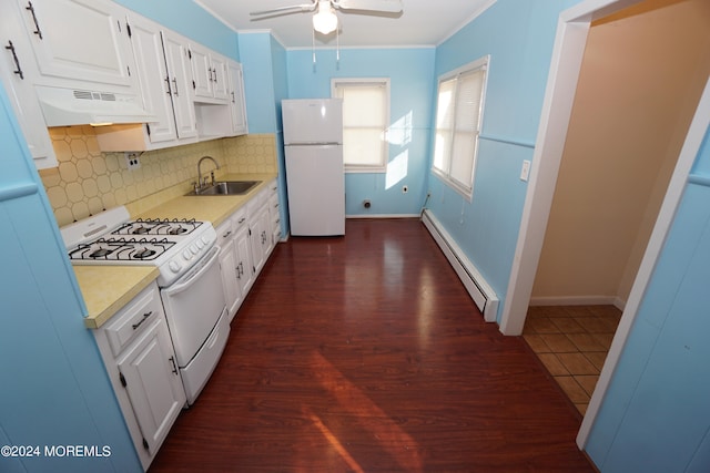 kitchen featuring white appliances, baseboard heating, dark wood-type flooring, extractor fan, and white cabinetry