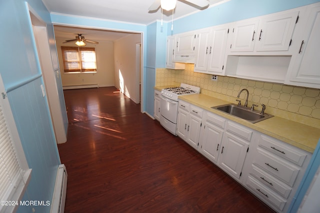 kitchen featuring white range, sink, and white cabinetry