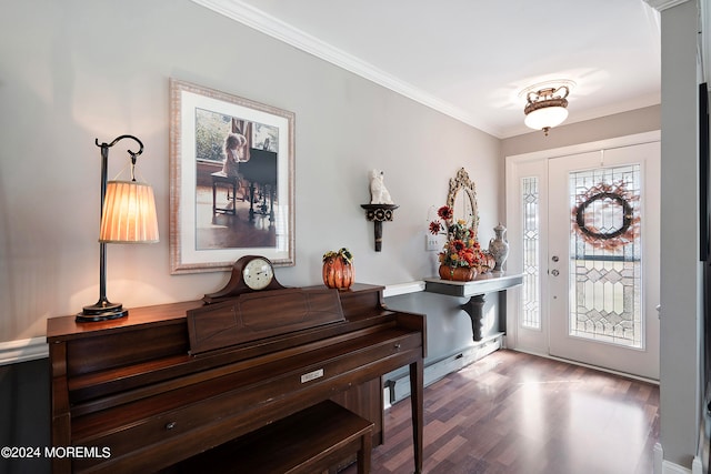 foyer entrance with wood-type flooring and ornamental molding