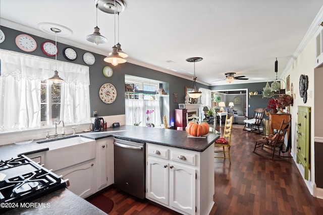 kitchen with kitchen peninsula, hanging light fixtures, white cabinets, and dark hardwood / wood-style floors