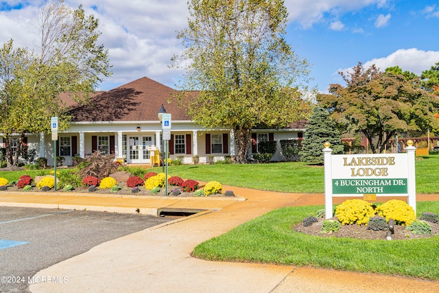 view of property's community with a lawn