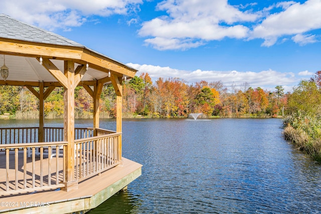 view of dock featuring a gazebo and a water view