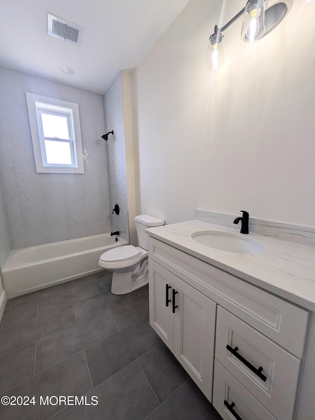 full bathroom with vanity, toilet, tile patterned floors, and tiled shower / bath