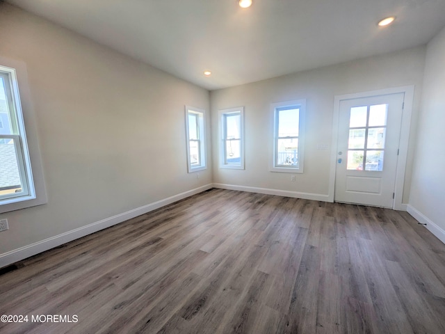 unfurnished room with hardwood / wood-style floors