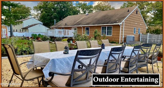 view of patio with a deck and central AC unit