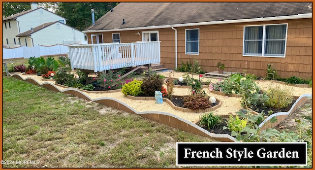 back of house with a yard and a wooden deck