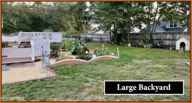 view of yard featuring a deck