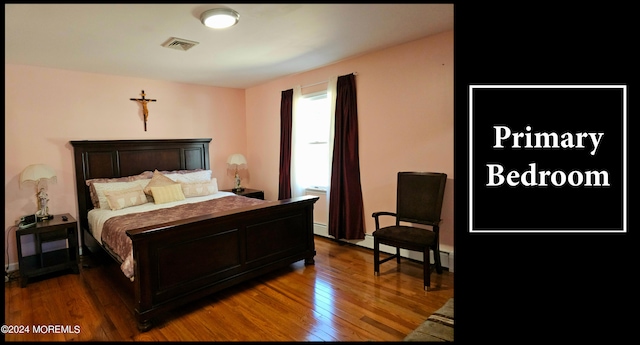 bedroom featuring hardwood / wood-style floors