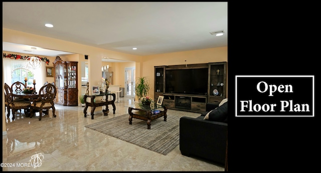 living room featuring an inviting chandelier