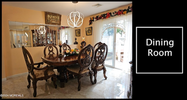 dining space featuring a chandelier