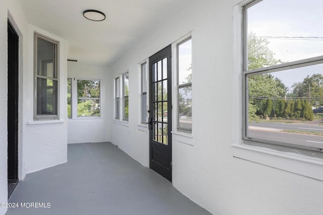 doorway to outside featuring a healthy amount of sunlight