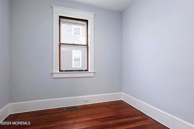 spare room featuring hardwood / wood-style floors