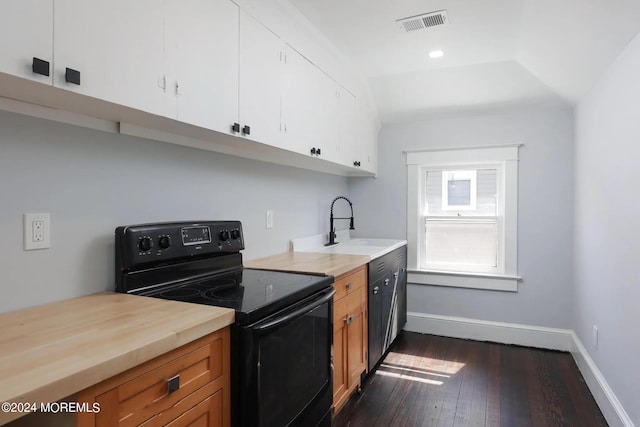 kitchen featuring lofted ceiling, dark hardwood / wood-style floors, white cabinets, sink, and black range with electric stovetop