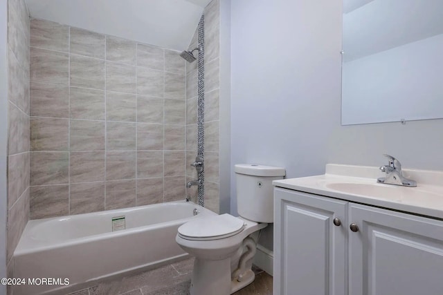 full bathroom with vanity, tiled shower / bath combo, toilet, and tile patterned floors