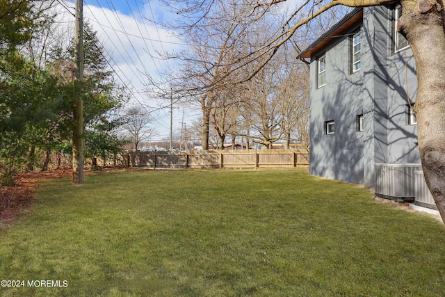 view of yard with central AC unit