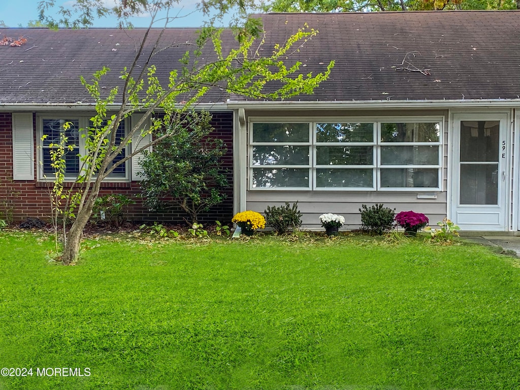 exterior space with a yard