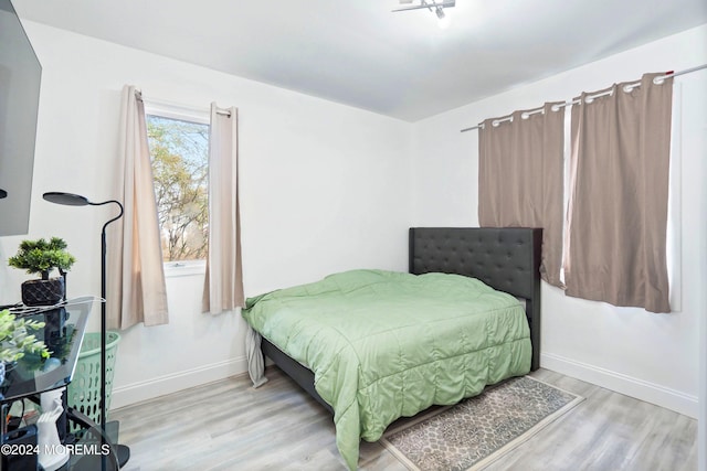 bedroom with light hardwood / wood-style flooring