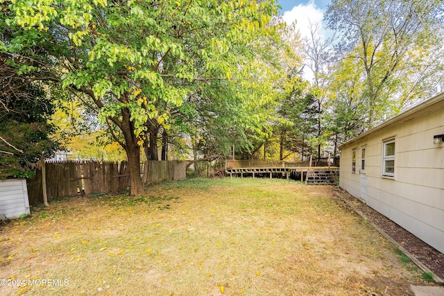 view of yard featuring a deck