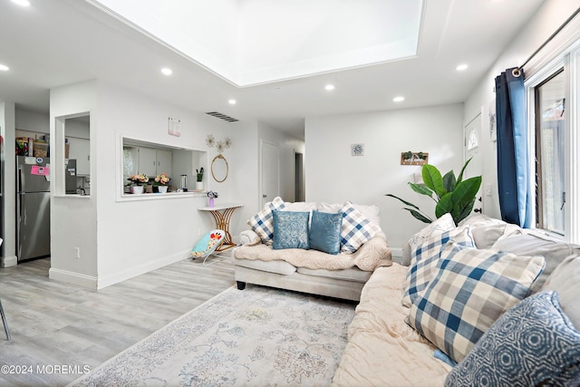 living room with light hardwood / wood-style floors