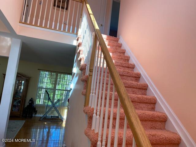 staircase with a towering ceiling