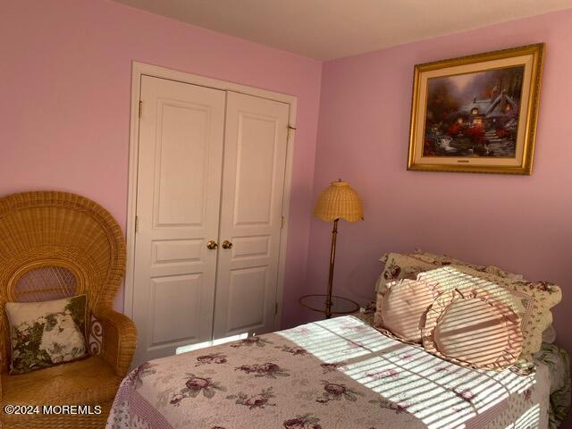 bedroom with a closet and carpet flooring